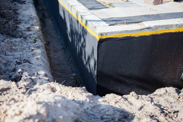 Professional Waterproofing technician working in Merrill, MI